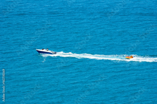 boat towing tube in the sea