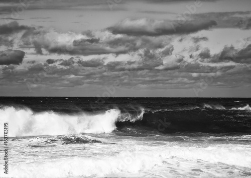 Black and White Image showing rolling waves at the Wild Coast of the Indian Ocean at South Africa