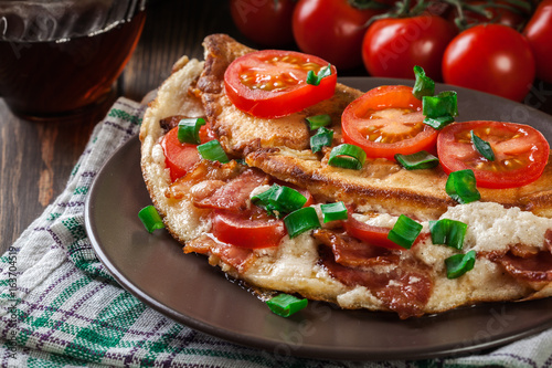 Omelette with bacon and tomatoes