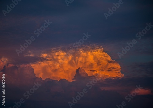 By the evening sun illuminated cumulonimbus over the city of Erlangen in Germany