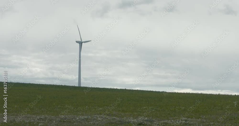 WIDE Wind turbine produce electricity in the field on a windy day. Clean, renewable enegry. 4K UHD WIDE Wind turbine produce electricity in the field on a windy day. Clean, renewable enegry. 4K UHD