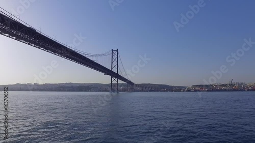 Imoressive Bridge over Tagus River in Lisbon - The 25th April Bridge aka Salazar Bridge photo