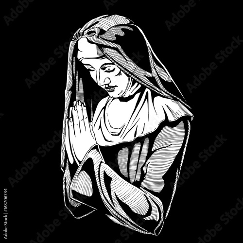 Nun is praying.