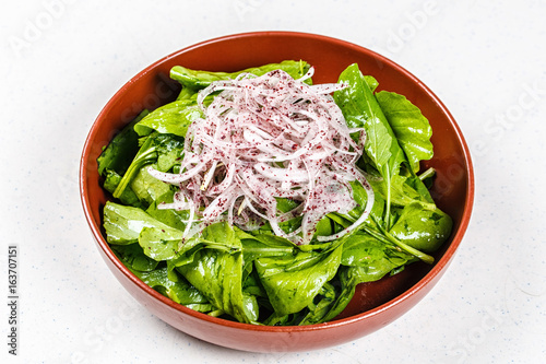 Fresh healthy garden salad on brown plate photo