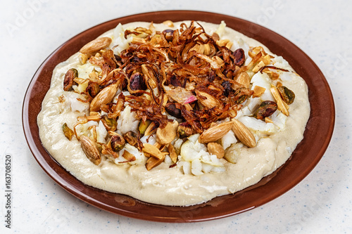 Hummus with olive oil and nuts