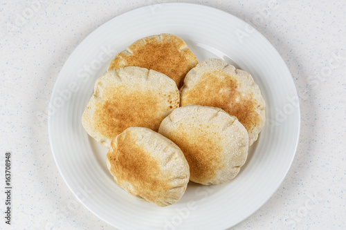 Freshly baked Arabic bread batbout photo