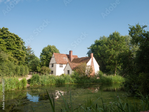 Принти на полотні Willy Lotts' cottage and river front on a clear sunny day