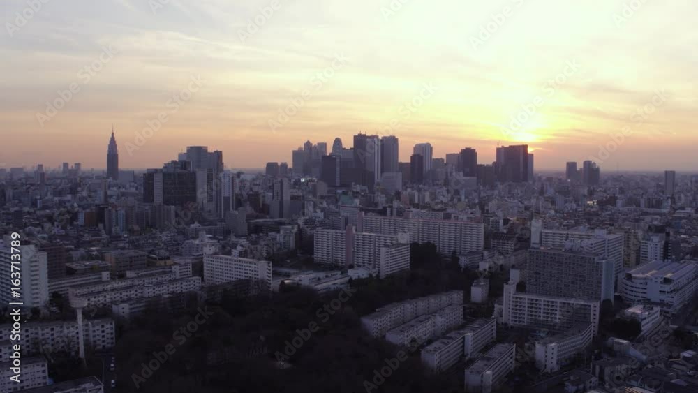 Japan Tokyo Aerial v57 Flying low over Shinjuku area panning with cityscape views at sunset Japan Tokyo Aerial v57 Flying low over Shinjuku area panning with cityscape views at sunset