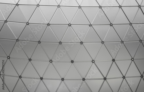 Abstract close-up view of modern aluminum ventilated triangles on building