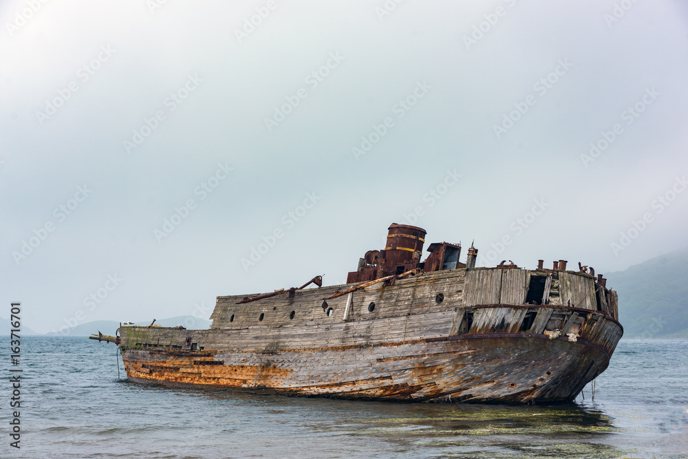 Remains of the old ship at the seashore Remains of the old ship at the seashore