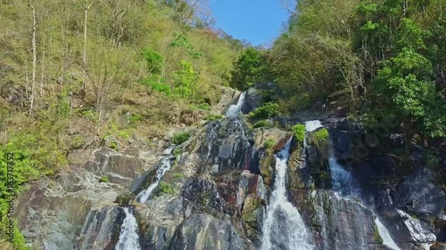 High Aerial Panorama Rocky River Waterfall against Blue Sky photo