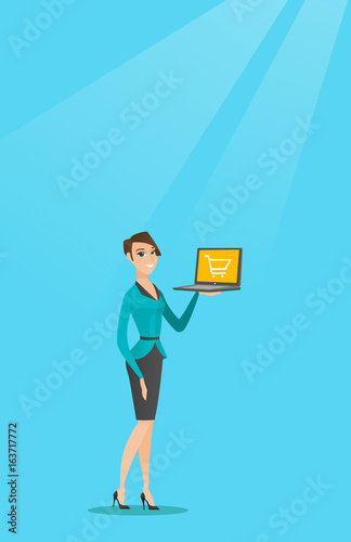 Woman holding laptop with trolley on a screen.