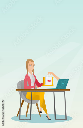 Caucasian woman getting shopping bags from laptop.