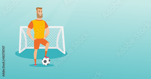 Young caucasian football player with a ball.