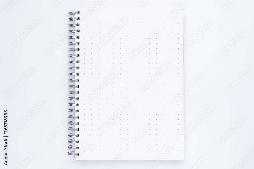 Top view of spiral notebook with dotted pattern pages Top view of spiral notebook with dotted pattern pages