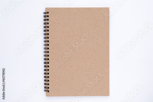 The top view of brown cover spiral notebook on white background