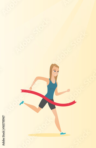Young caucasian sportswoman crossing finish line.