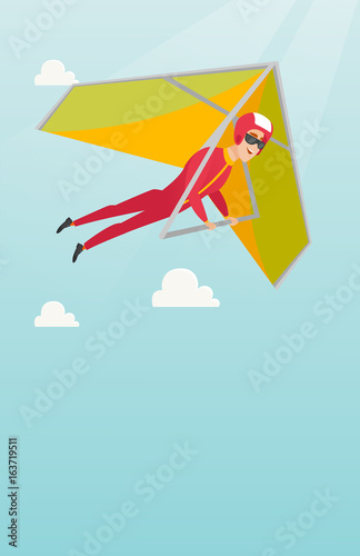 Young caucasian man flying on hang-glider.