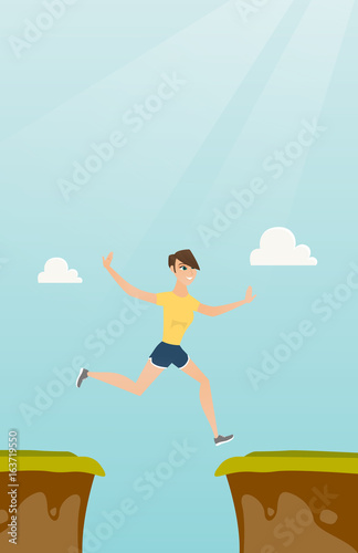 Young caucasian sportswoman jumping over the cliff