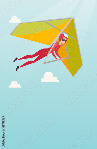 Young caucasian woman flying on hang-glider.