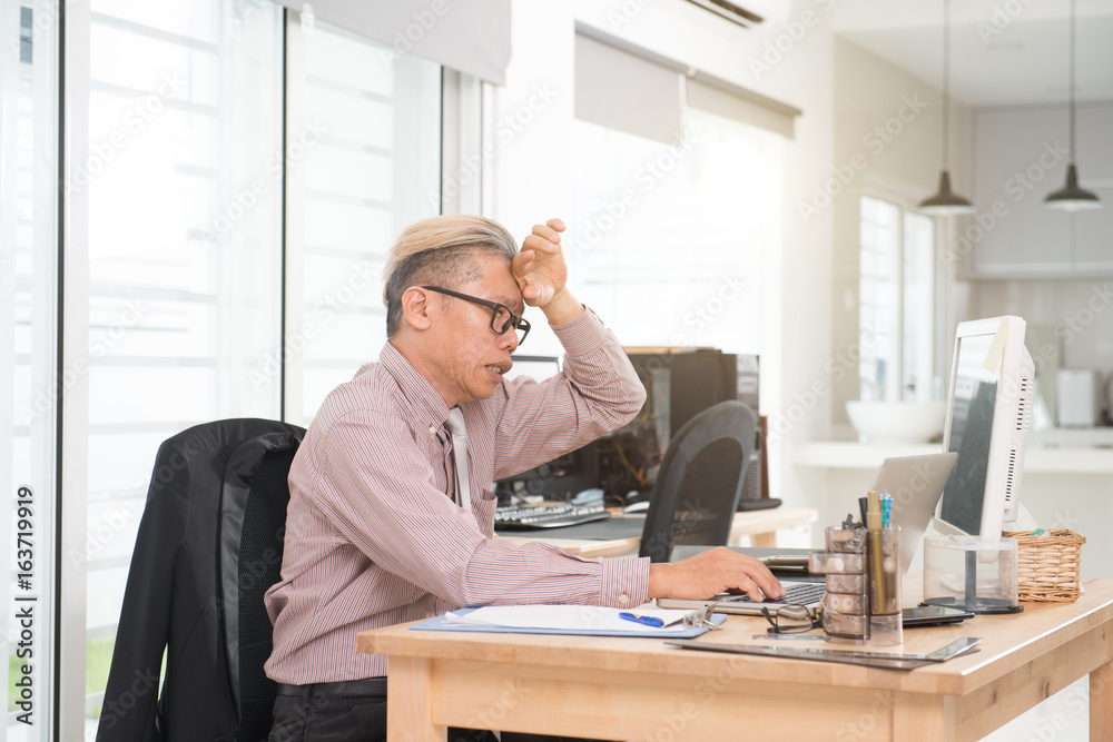 asian business senior male sick at work place asian business senior male sick at work place