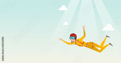 Caucasian parachutist jumping with a parachute.