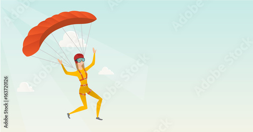 Young caucasian skydiver flying with a parachute.