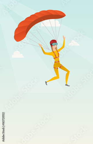 Young caucasian skydiver flying with a parachute.
