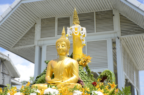 Buddha statue on bright sky background. photo