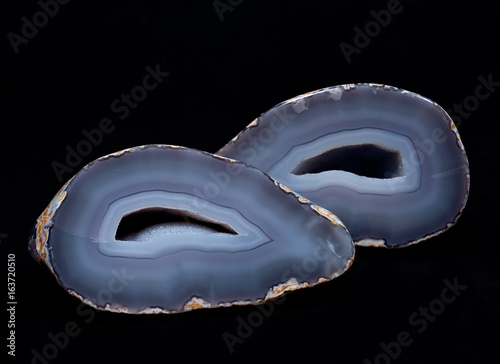 Partially polished blue lace agate geode with crystaline druzy center isolated on white background photo