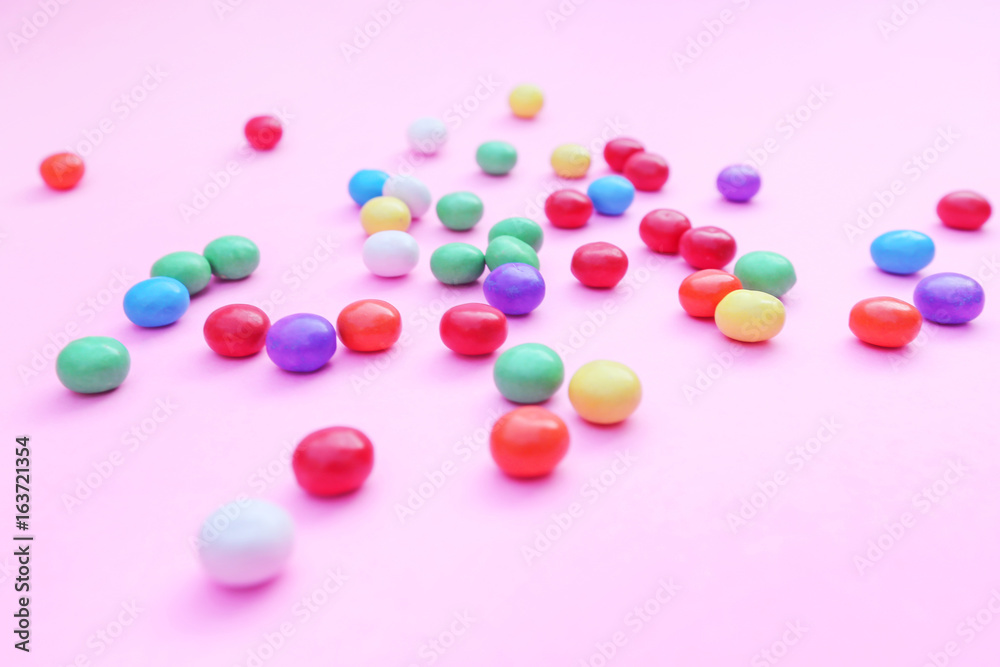 Colorful candies on pink Colorful candies on pink