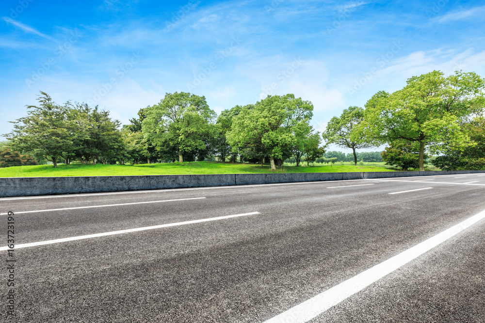 asphalt road and green tree in countryside asphalt road and green tree in countryside