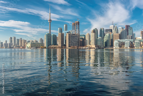 Beautiful Toronto skyline with CN Tower and skyscrapers reflection on Ontario lake, Canada