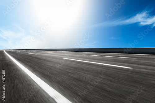 Motion blurred asphalt road background