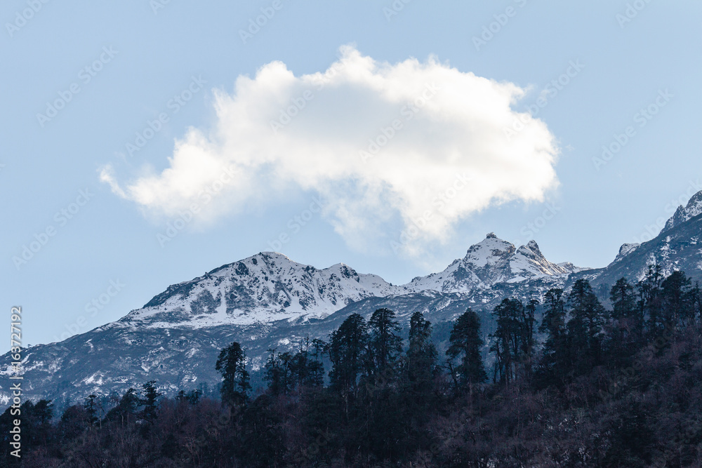 Mountain with little snow and cloud on the top sunlight in the morning in winter at Lachen in North Sikkim, India.