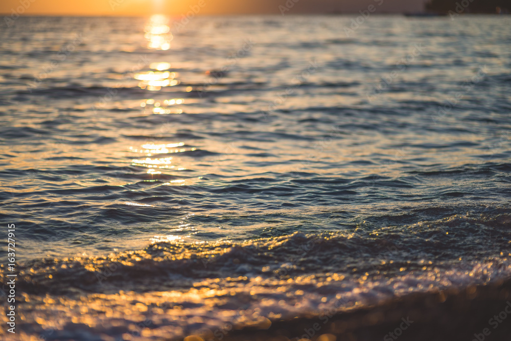 Sea waves and ripples at sunset background Sea waves and ripples at sunset background