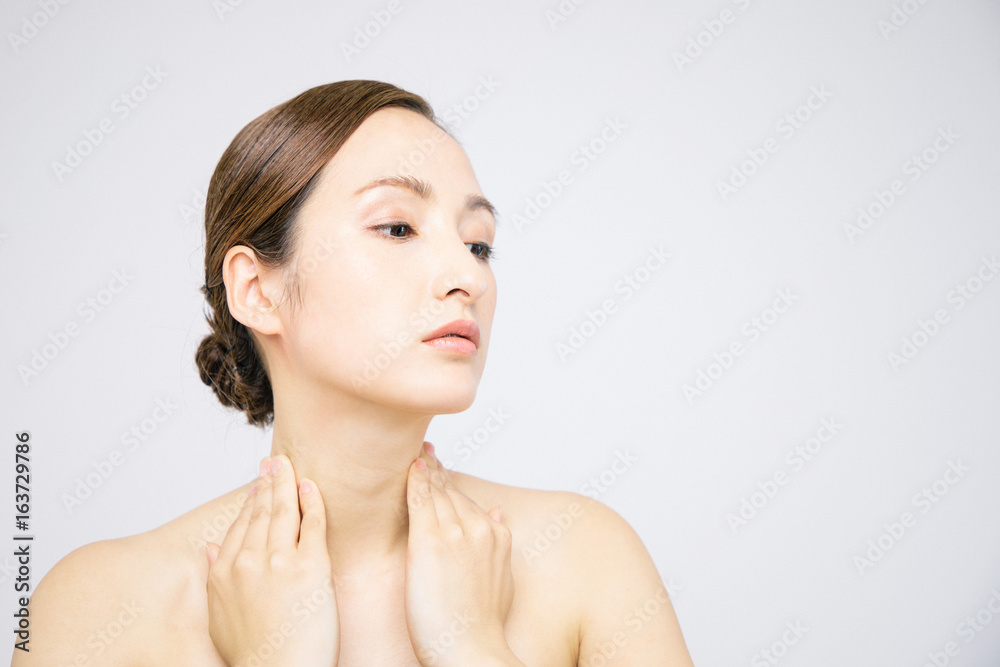 beautiful woman massaging her neck. lymphatic massage. beautiful woman massaging her neck. lymphatic massage.
