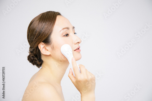 woman using electric facials. skincare concept photo