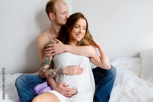 Happy married couple waiting for the birth of a child. Pregnancy. photo