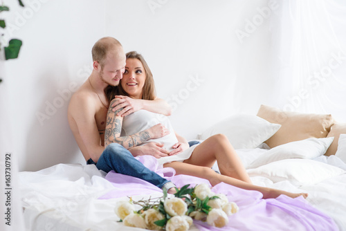 Happy married couple waiting for the birth of a child. Pregnancy.