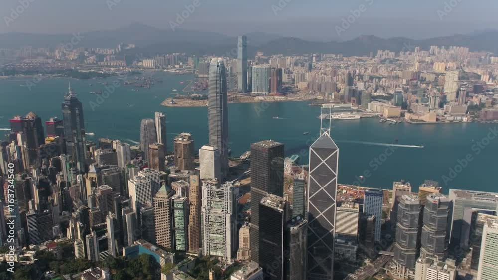 Hong Kong Aerial v74 Flying over Central District towards Kowloon with cityscape views 2/17