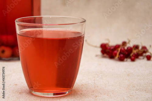 Red compote of berries in a glass.