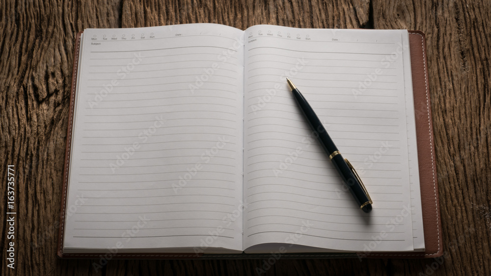 Image of open blank notebook on wooden table. ready for adding text.