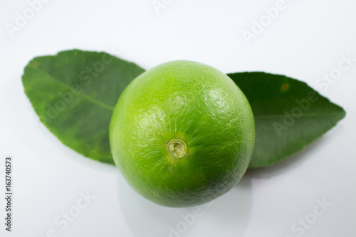  lemon and green leaf isolated on white background