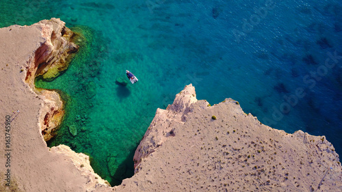 Aerial drone photo of famous caves of Ksylobatis near Pori beach, Koufonissi island. Cyclades, Greece © aerial-drone