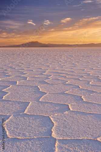 Salt flat Salar de Uyuni in Bolivia at sunrise photo