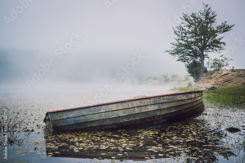 Old boat on Maulazzo Lake, Nebrodi, Sicily - Italy photo