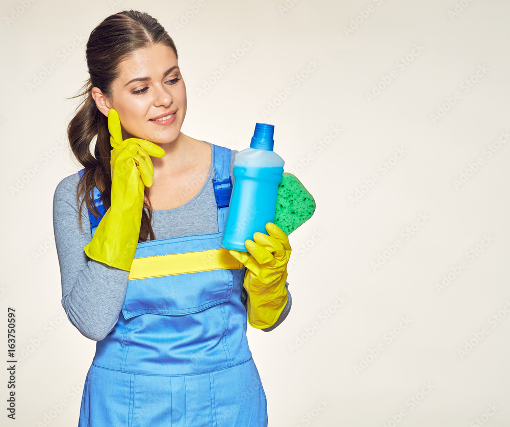 Woman holding cleaning sponge with cleaner. Woman holding cleaning sponge with cleaner.