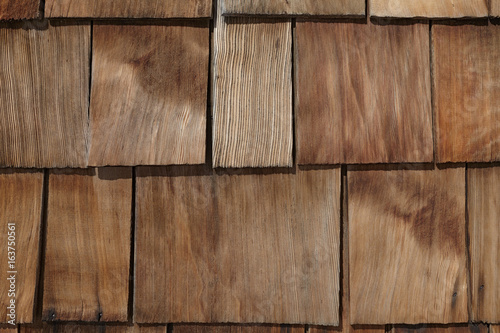 Natural unpainted old house branchy wood wallboard pattern background. photo