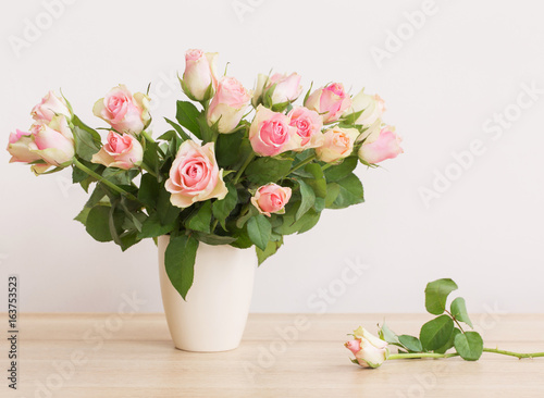 pink roses in vase on white background © Maya Kruchancova